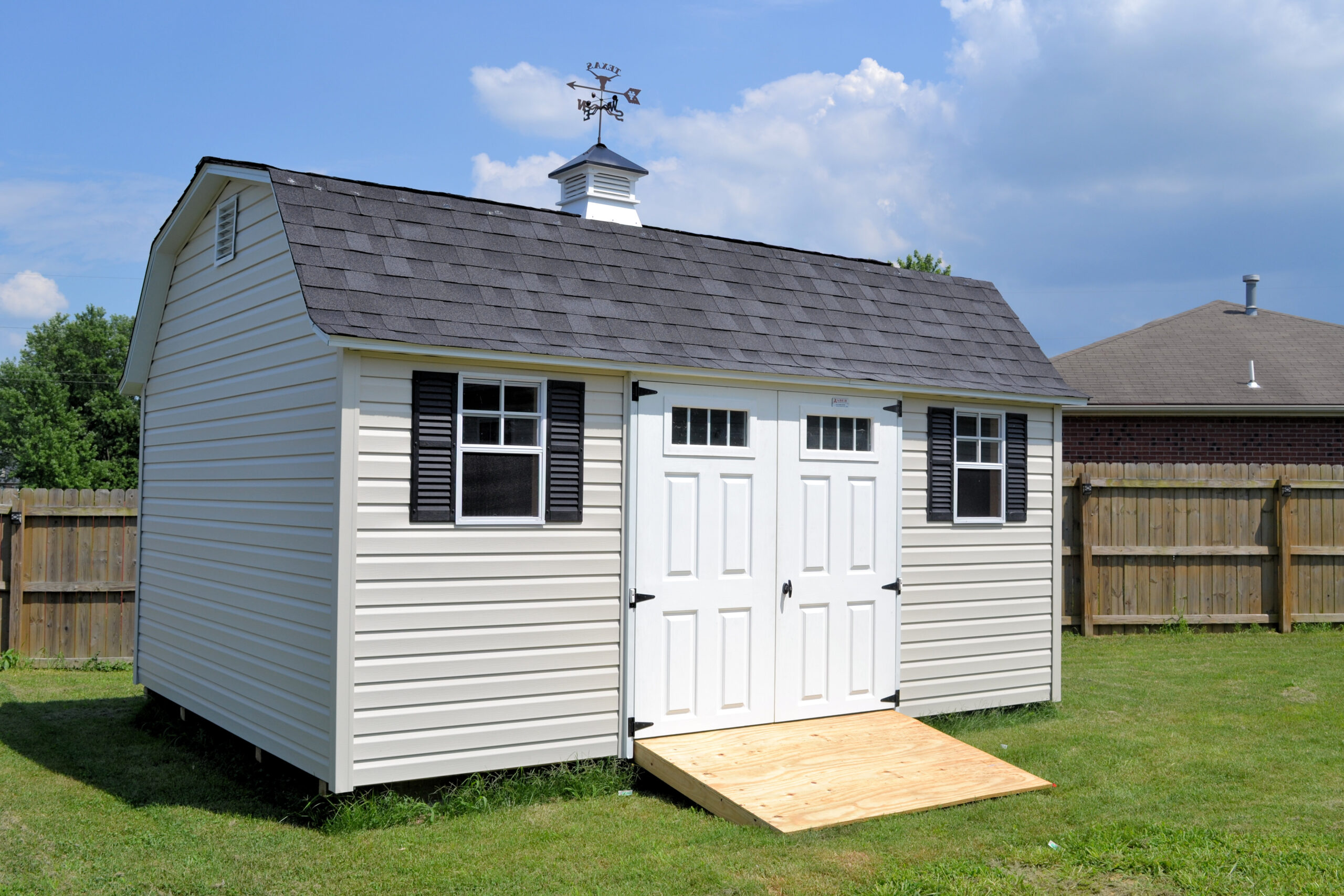 garden shed with transom windows and cupola
