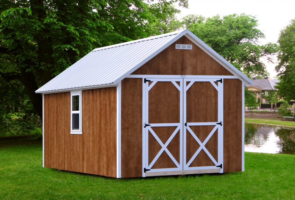 Brown urethane stained shed with white trim, a white metal roof, double doors, a white window, and a white vent sitting in a backyard with a pond behind it.