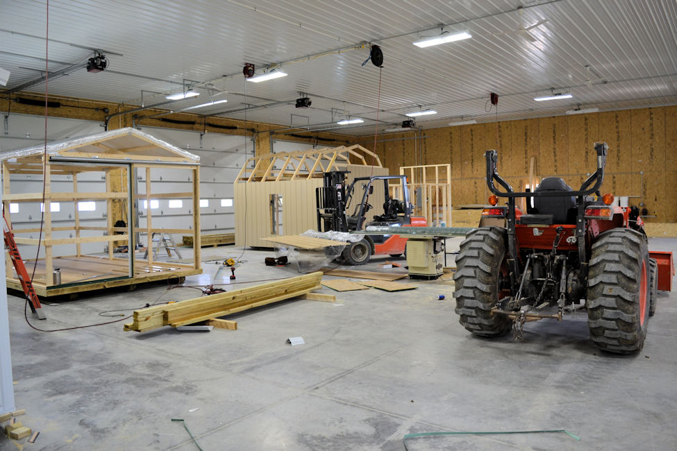 Interior of Raber's warehouse with 2 sheds being built.